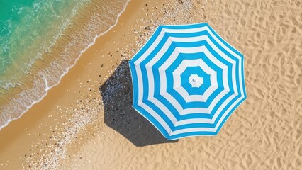 Naklejka premium Aerial view of blue and white striped umbrella on sandy beach with turquoise waves