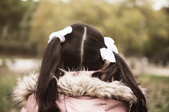 rear view of alone girl in park, lonely children