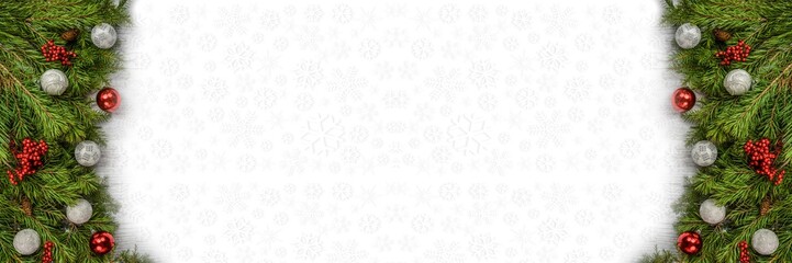 Christmas background with fir tree branches ornaments and snowflakes on white backdrop
