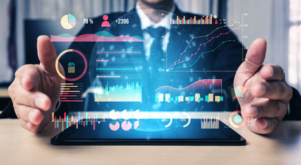 A businessman is presenting a futuristic data visualization on a tablet, showcasing various charts and graphs that represent key performance metrics and insights. Impute