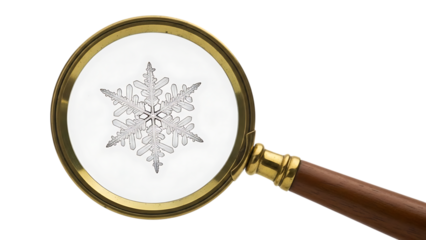 Magnifying glass viewing intricate ice crystal snowflake detail close up