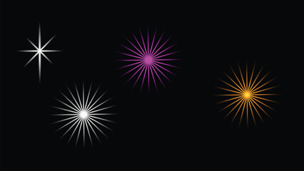 Fototapeta premium Four colorful starburst lights on black background