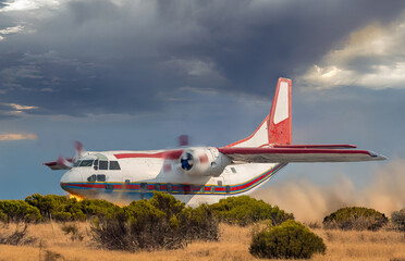 Damaged propeller plane makes a hard landing on a plain
