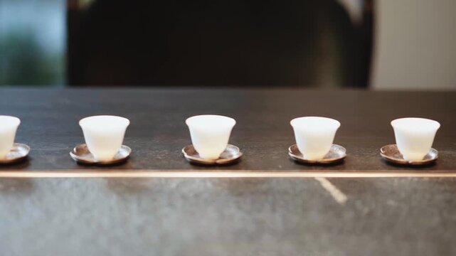 row of tea cup on table