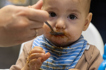 Baby Feeding Time with Messy Face Close up