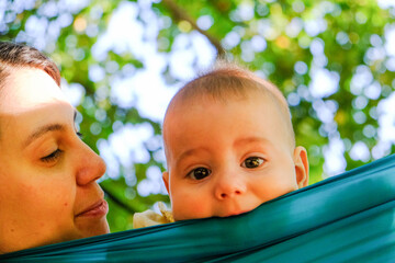 Child Peeking Over Hammock in Park Copy Space