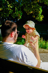 Father and Baby Enjoying a Sunny Day in the Park Copy Space