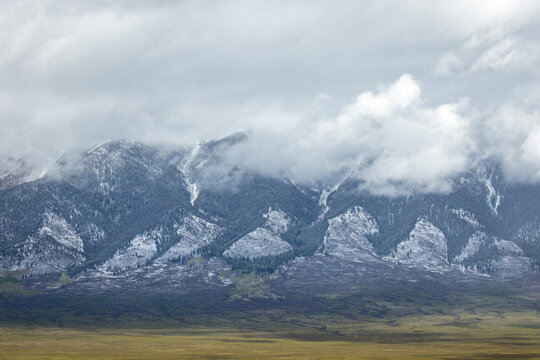 Snow trail on distant mountain range peaks