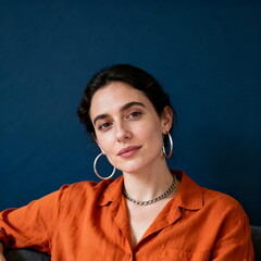 Woman in Orange Shirt with Hoop Earrings