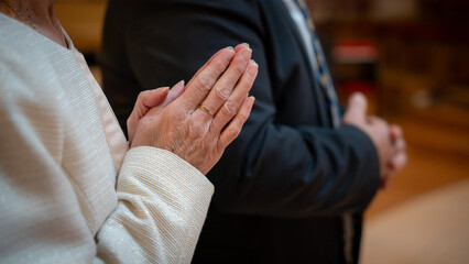 Hands folded together in prayer