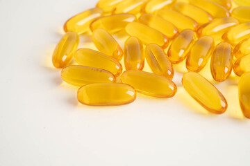 Fish oil or Cod liver oil gel in capsules with omega 3 vitamins, supplementary healthy food.