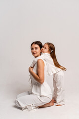 a newborn baby in its mother's arms, the mother soothes the baby before bedtime by rocking it to sleep