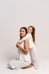 a newborn baby in its mother's arms, the mother soothes the baby before bedtime by rocking it to sleep