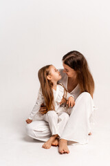 a newborn baby in its mother's arms, the mother soothes the baby before bedtime by rocking it to sleep