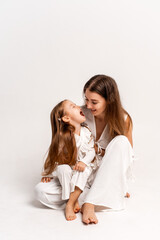 a newborn baby in its mother's arms, the mother soothes the baby before bedtime by rocking it to sleep