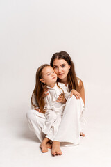 a newborn baby in its mother's arms, the mother soothes the baby before bedtime by rocking it to sleep