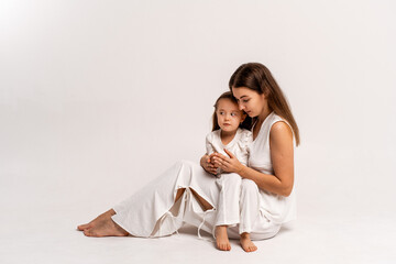 a newborn baby in its mother's arms, the mother soothes the baby before bedtime by rocking it to sleep