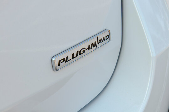 February 11, 2022, Seoul, South Korea - The 'Plug-in AWD' emblem on a white Ford Explorer PHEV.