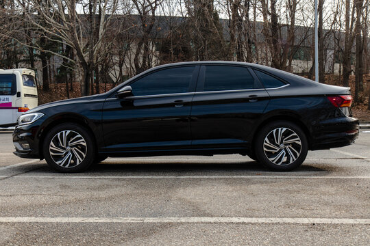January 23, 2022, Seoul, South Korea - A black Volkswagen Jetta sedan parked in an outdoor parking lot.