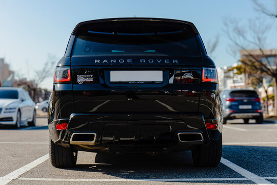 January 18, 2022, Seoul, South Korea - A rear view of a black Land Rover Range Rover Sport SUV parked in an outdoor parking lot.