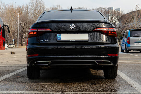 January 23, 2022, Seoul, South Korea - A rear view of a black Volkswagen Jetta sedan parked in an outdoor parking lot.