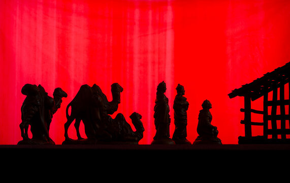Silhouette magi three wise men Christmas red backdrop