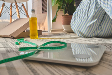 Person starting new year resolutions, focusing on health and weight loss goals at home