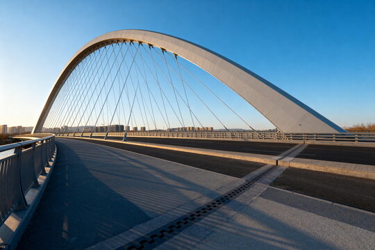 Modern Arch Bridge with Cables in Urban Area