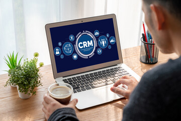 Fototapeta premium Customer relationship management system on modish computer for CRM business and enterprise