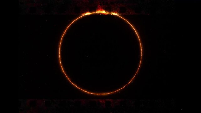 Glowing fire ring eclipse on old film strip