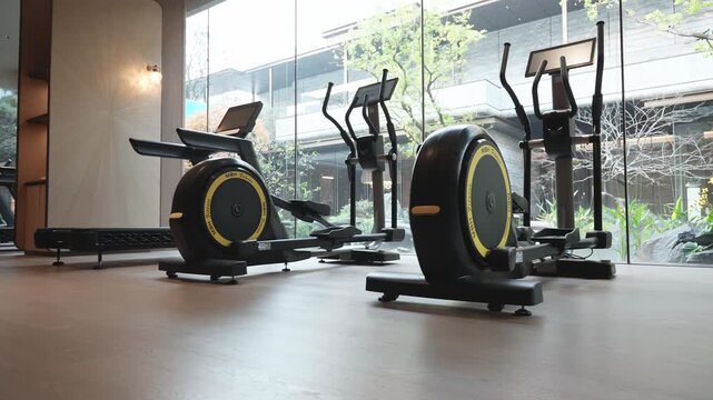 Fitness machine with screen by window