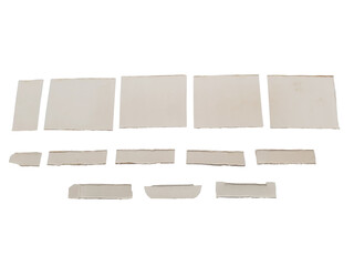 Various sizes of off white torn paper fragments isolated on transparent background