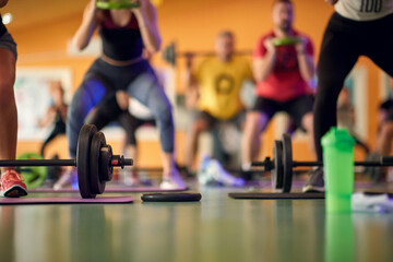 Full body activation exercise with weights in fitness center.. Healthy lifestyle, sport, workout concept