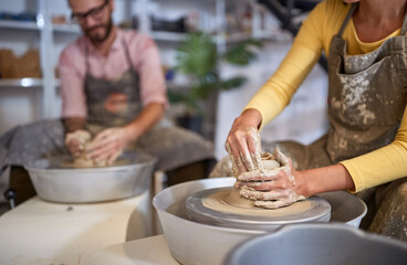 Group of People shaping pottery from wet clay. Creative, hobby ,workshop  concept