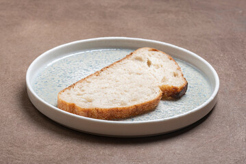 Slice of bread on white ceramic plate