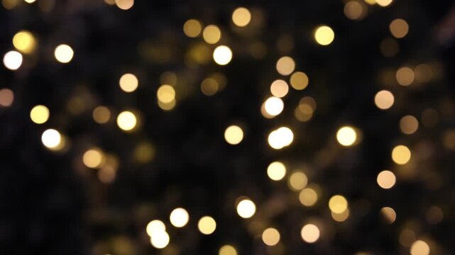 Flashing yellow Christmas lights and bokeh from the blur.