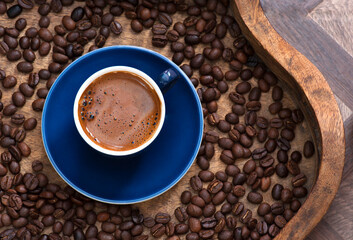 Blue Cup of Turkish Coffee on Tray filled with beans