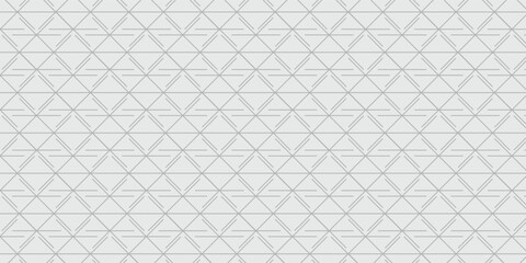 Fototapeta premium Minimalist abstract geometric background with repeating triangular line pattern in soft grey shades.