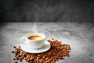 Coffee cup and coffee beans on gray background, Espresso crema coffee cup aromatic