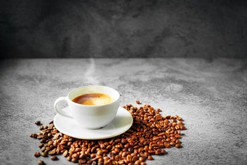 Fototapete Cafe Coffee cup and coffee beans on gray background, Espresso crema coffee cup aromatic  © NARONG