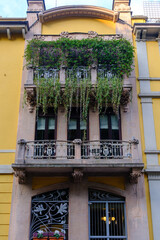 Old residential buildings along Via dei Praga in Milan, Italy