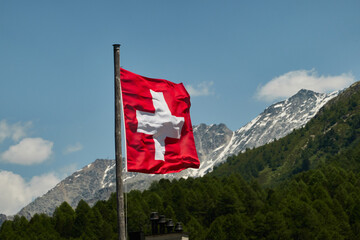 Panoramic view of Sils Maria village and Lake Sils during winter with snow covered Alps mountains...