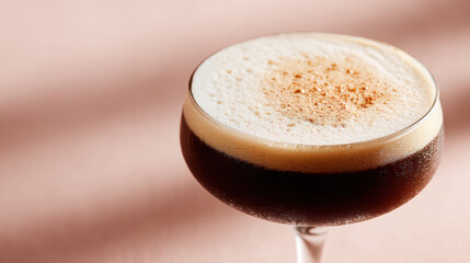 Espresso Martini Elegance: A sophisticated Espresso Martini glass sits gracefully against a soft backdrop, its rich coffee hue, creamy foam and tasteful presentation exuding pure drink perfection.