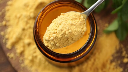 Nutritional yeast powder in amber glass jar
