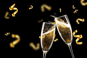 Two champagne flutes clinking with golden confetti falling on a black background. Festive toast,...