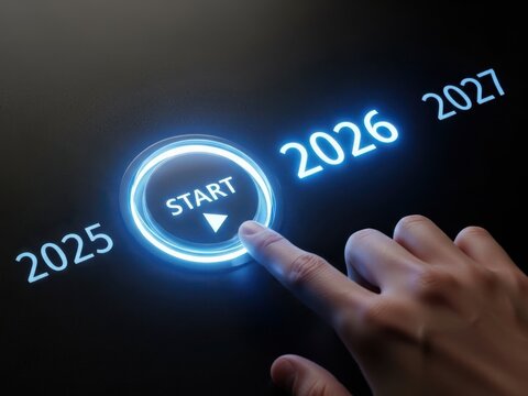 Hand pressing start button for the year 2026, symbolizing a new beginning and future goals.