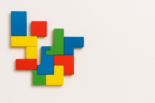 Autism Awareness Day puzzle concept with colorful blocks on white background - Powered by Adobe