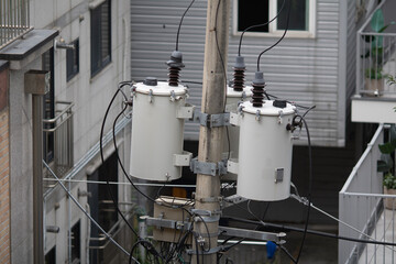 Power transformers on a pole to power a building in Korea. Single Phase pole mounted transformer.
