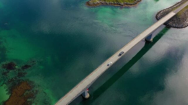 Cars crossing a bridge in the Lofoten Archipelago - Top down aerial footage