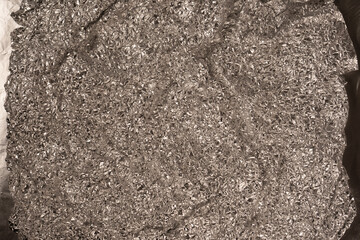 Shiny silver foil background. Top view.